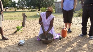 Tonga woman preparing traditional meal